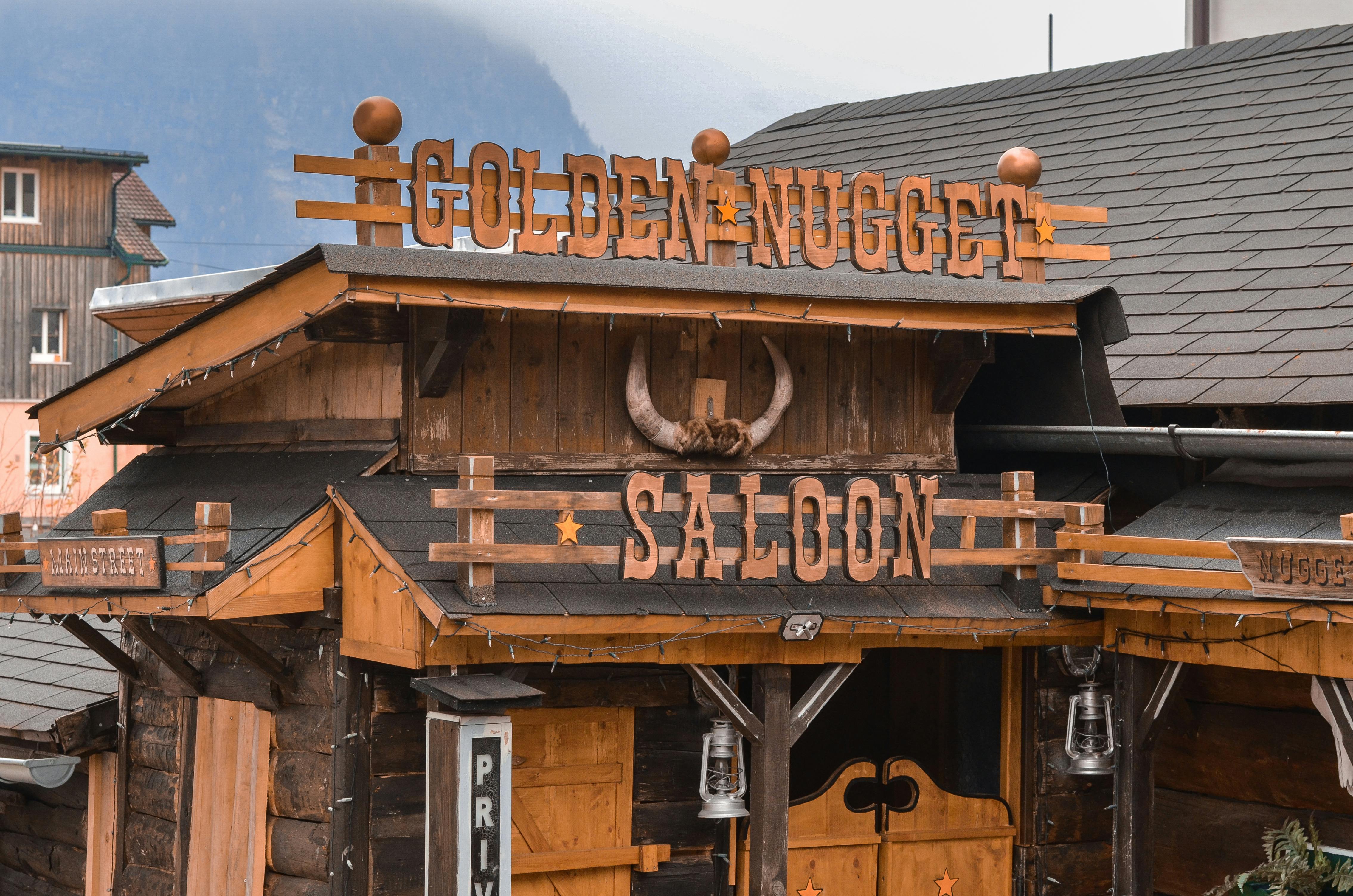 old building facade with creative letters behind mount in mist