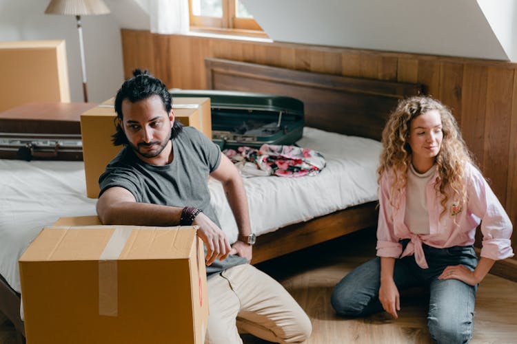 Content Diverse Couple Moving Into New House