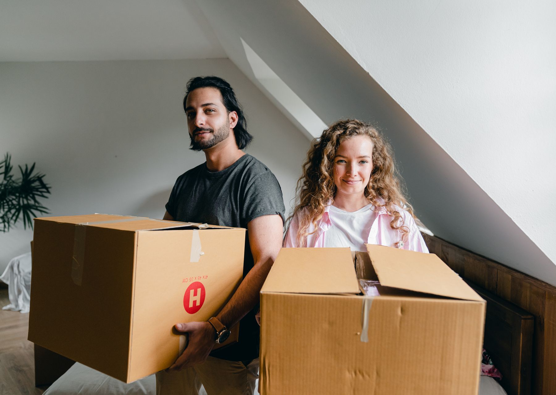 House removals in Swiss Cottage — crew wrapping and loading on moving day