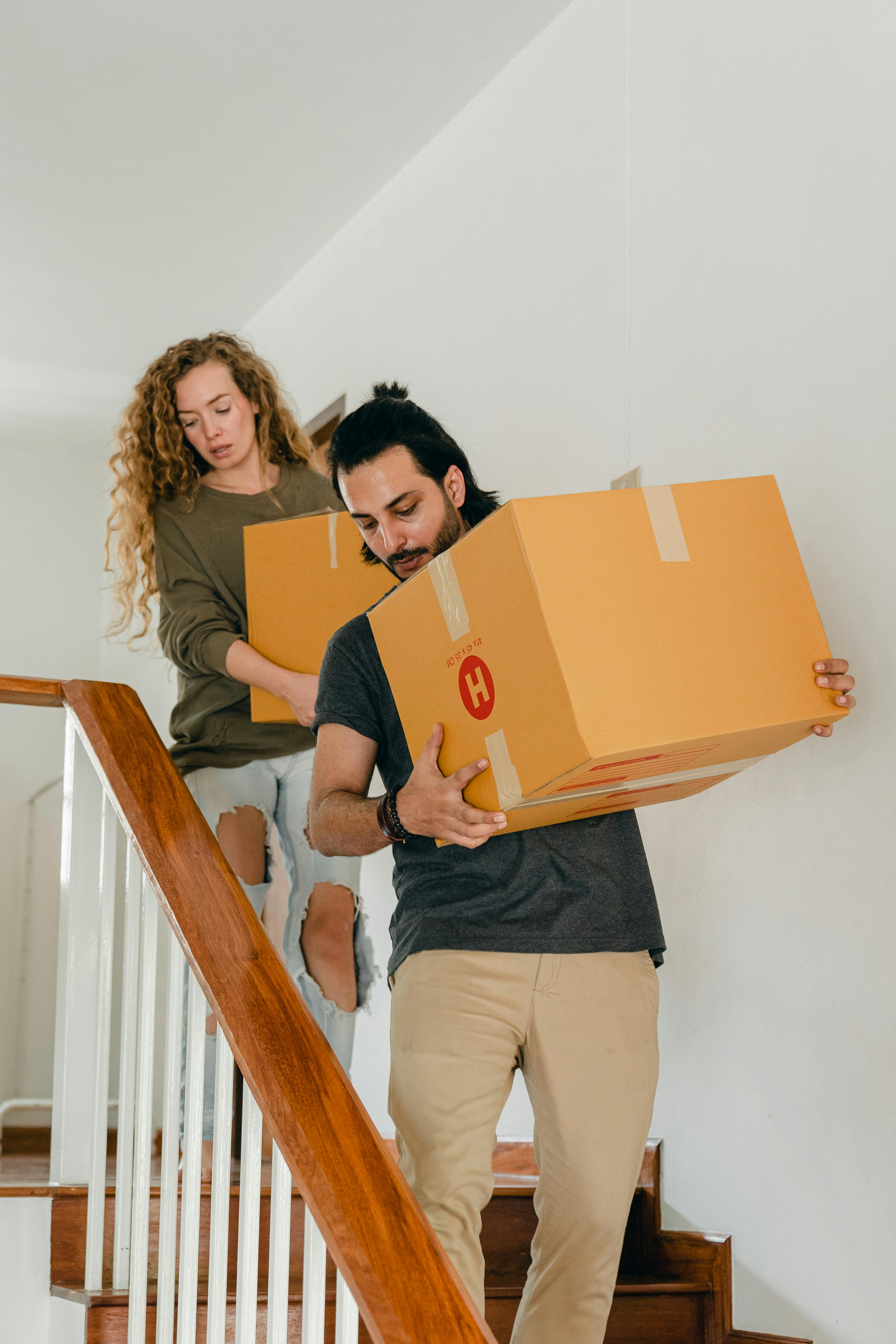 young diverse couple moving into new house