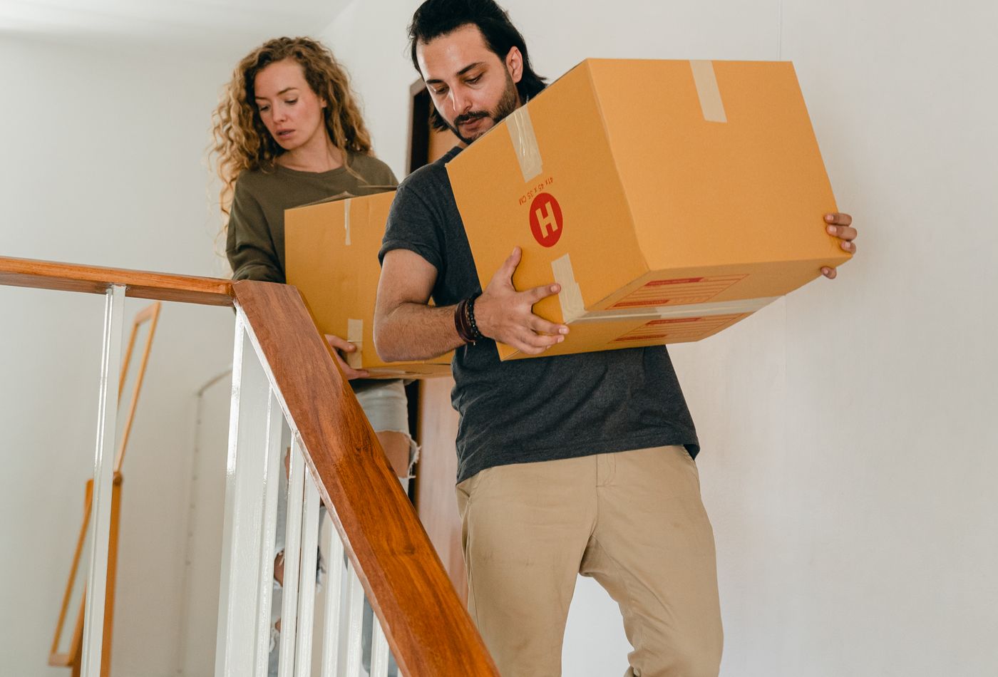 Movers delivering household boxes to a home in Canada
