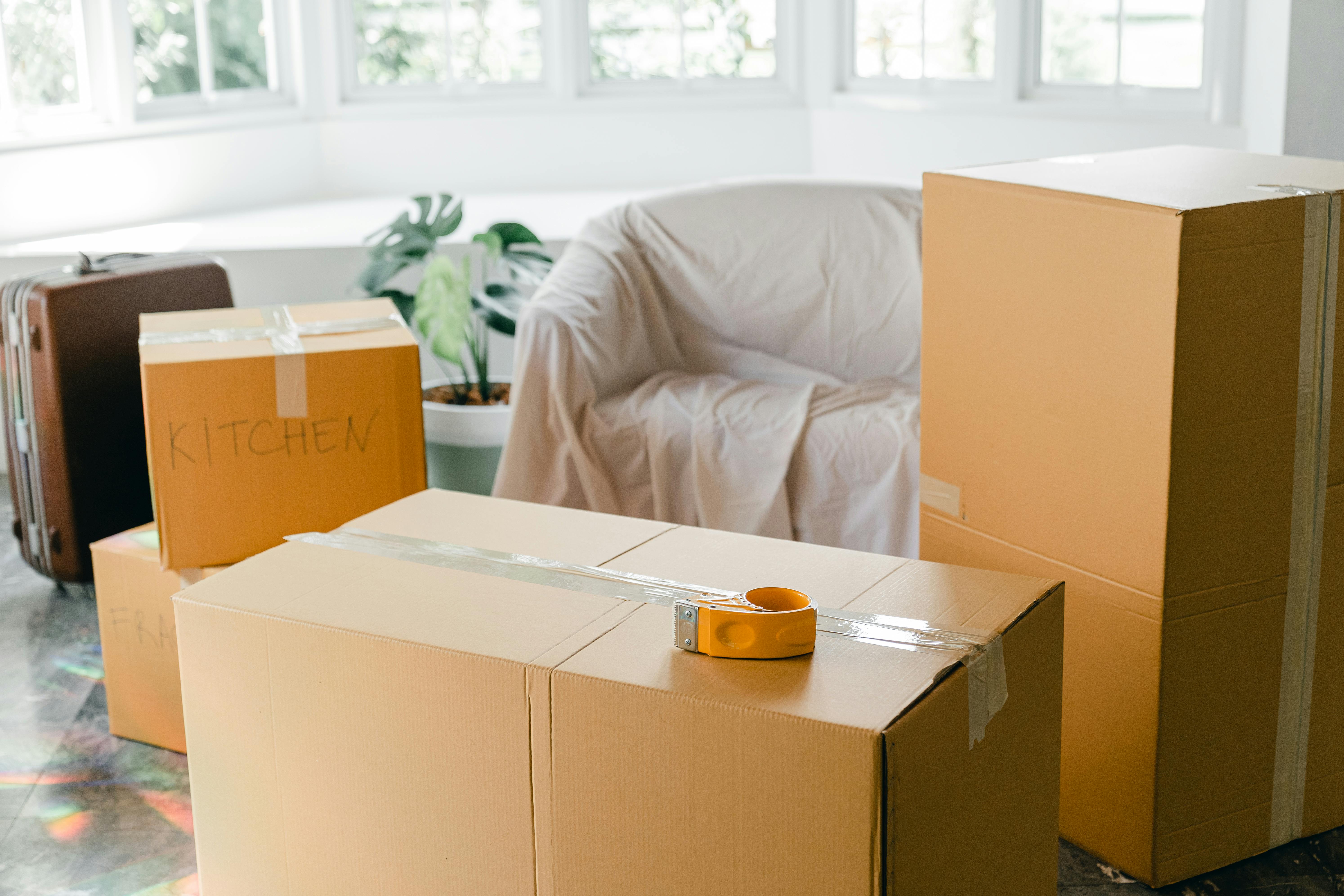 empty apartment with packed carton boxes before moving