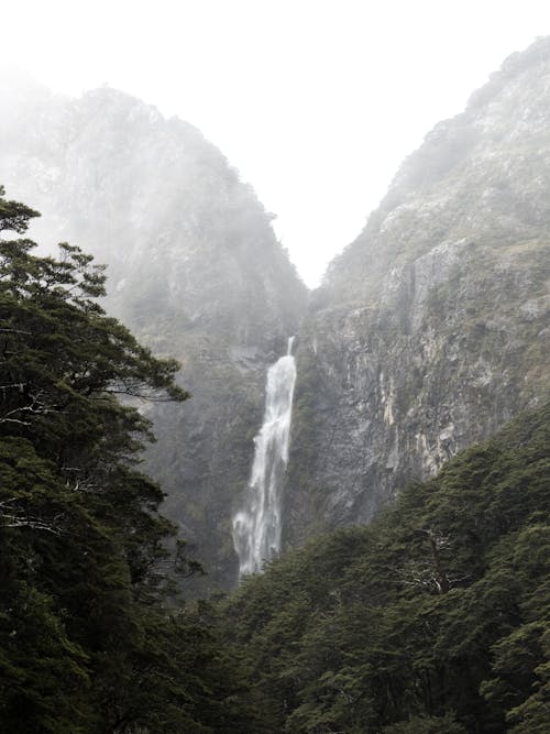 Photography of Waterfalls Between Mountain