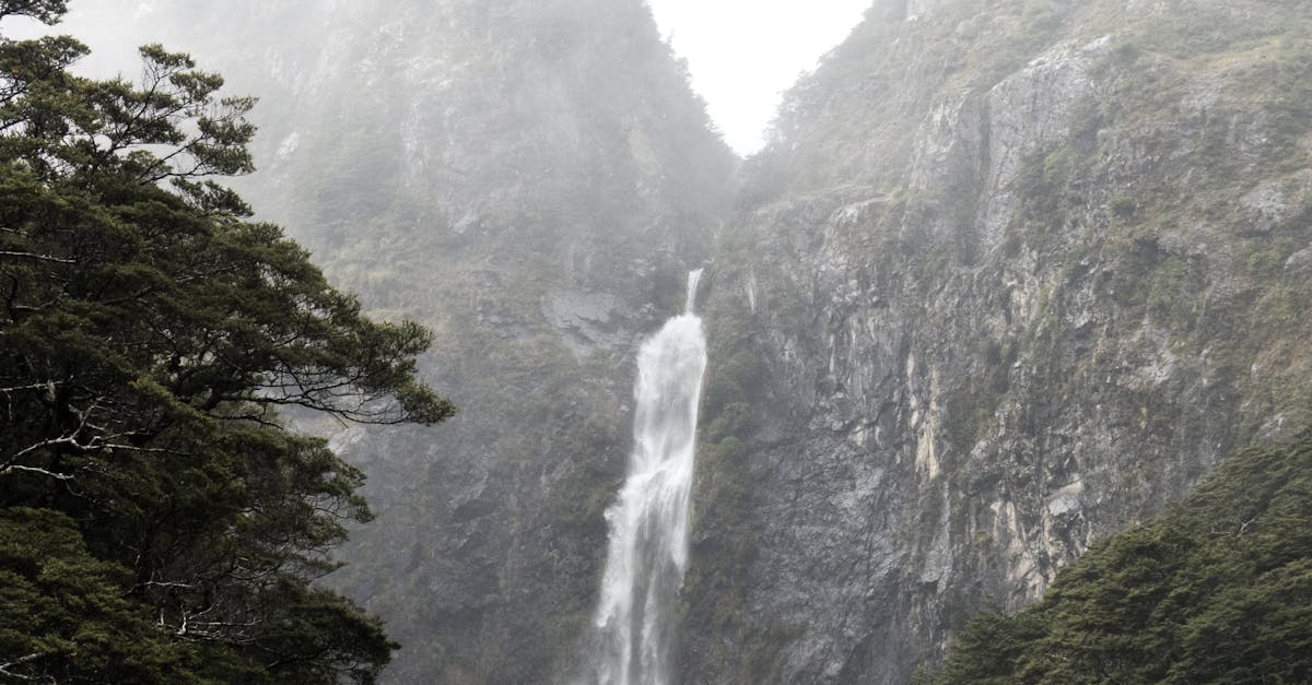 Photography of Waterfalls Between Mountain