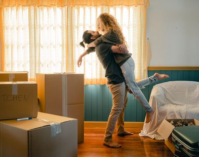 Couple unpacking boxes in their new home