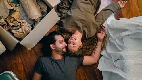 Loving couple resting on floor together