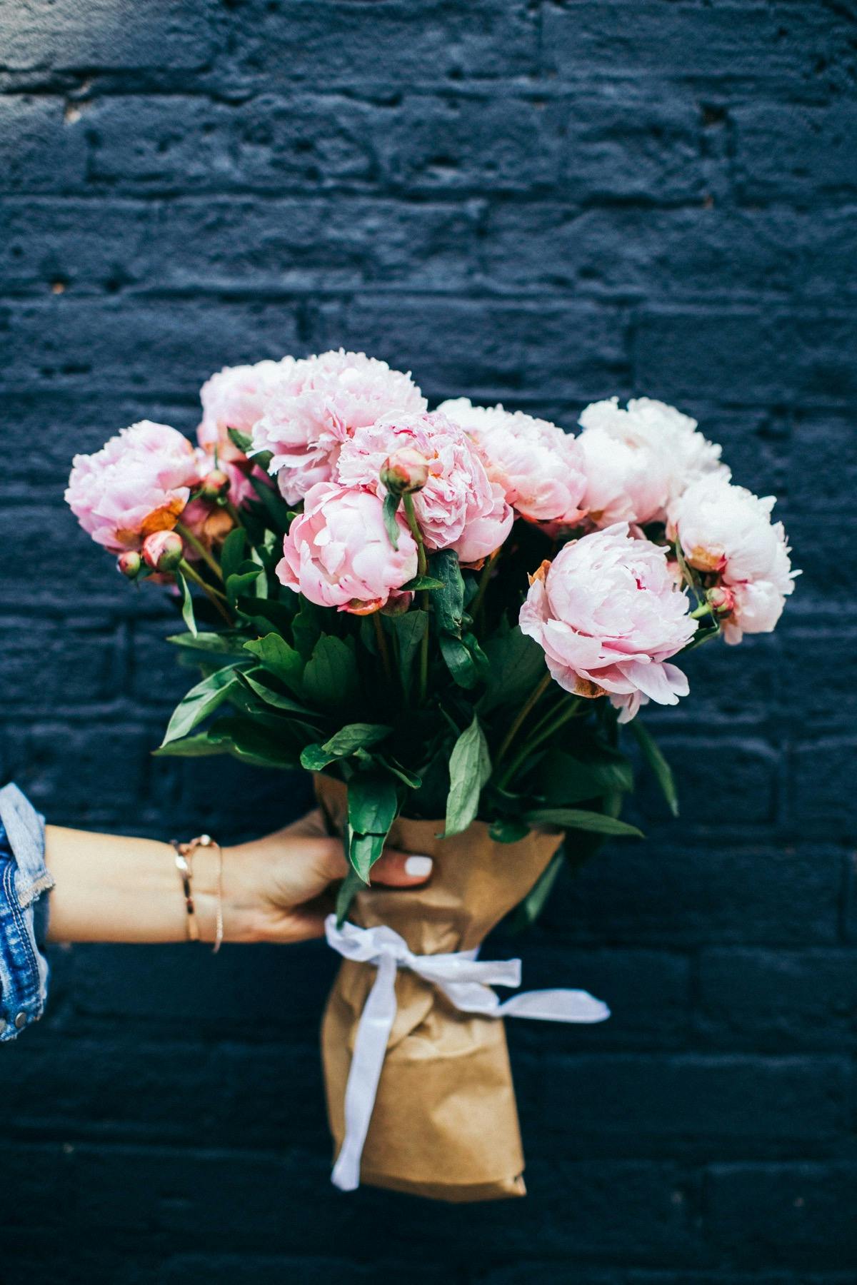 Person Holding Pink Peony Bouquet Free Stock Photo