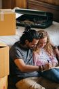 Loving couple planning future in new apartment after relocation