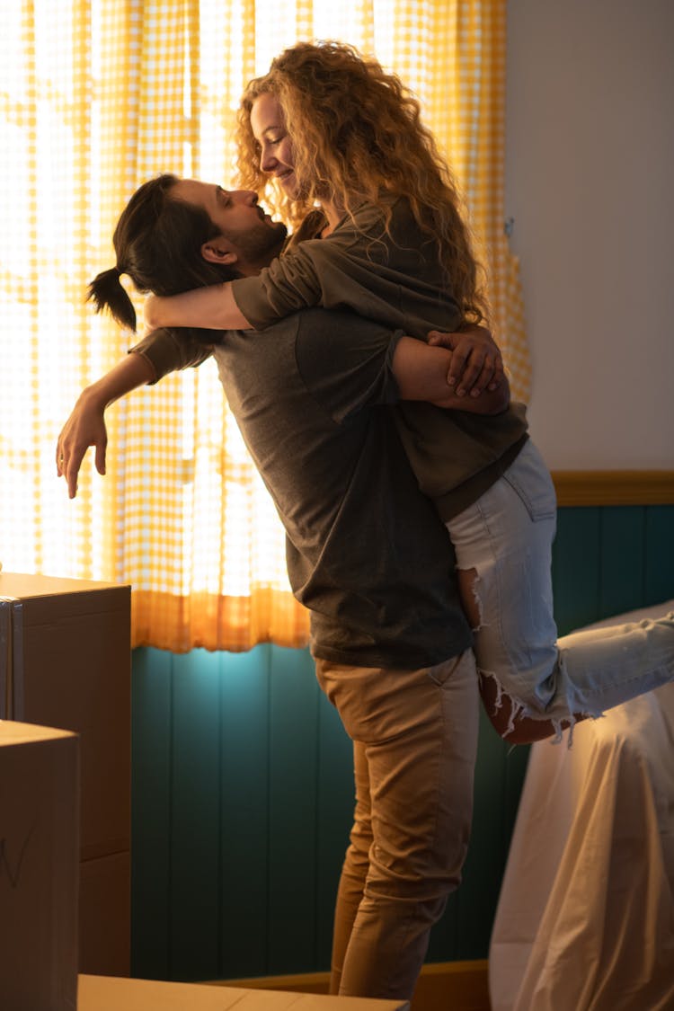 Cheerful Diverse Couple Celebrating Moving In Own Home