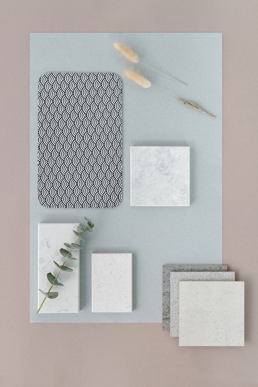Flat lay of tile samples, timber chips and natural material swatches
