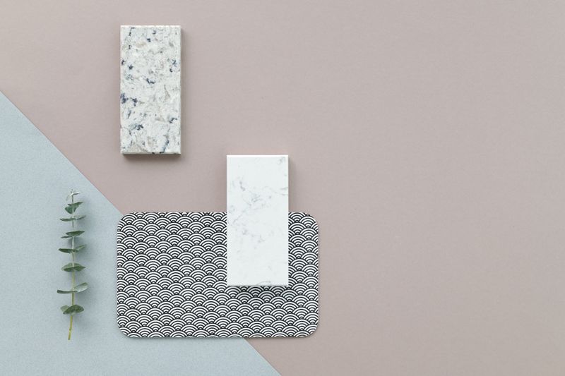 Studio Miel material consultation with stone, wood, linen, and finish samples