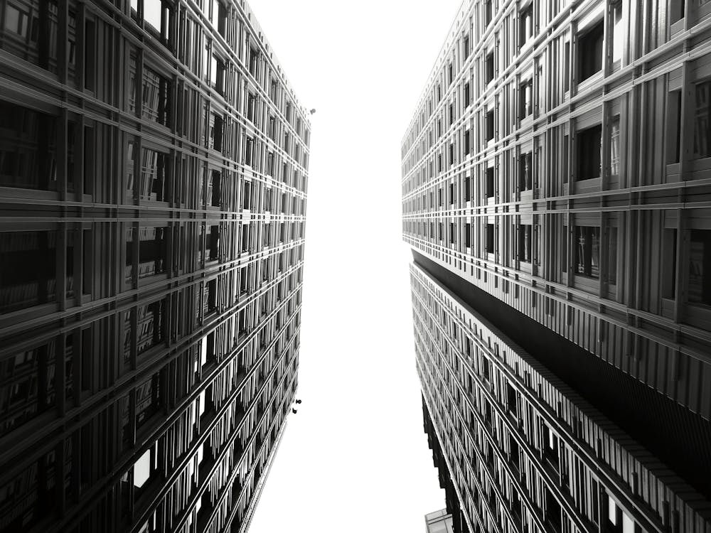 Grayscale Photography of Two Hi-rise Buildings