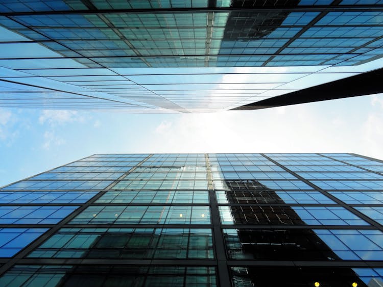 Low-angle Photography Of Glass Buildings