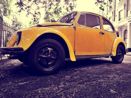 Closeup Photo of Yellow Volkswagen Beetle Coupe