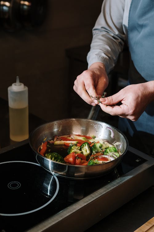 Person Holding Stainless Steel Bowl With Vegetable Salad