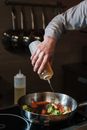 Person Holding Stainless Steel Bowl With Yellow Handle