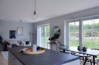Minimalist interior of kitchen combined with living room in light house