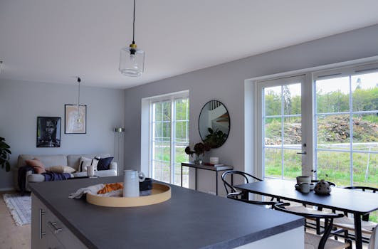 Stylish Scandinavian interior design with a view of the outdoors, photographed in natural daylight.