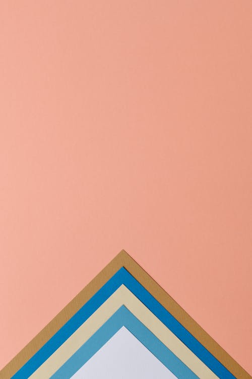 Colorful Triangles on Pink Background 