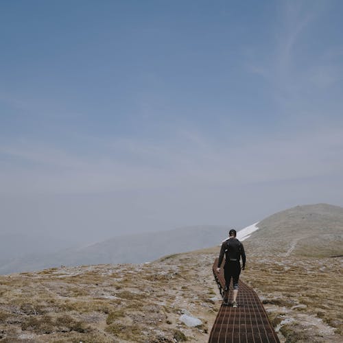 Back View of a Person Walking on a Footpath in Kosciuszko National Park