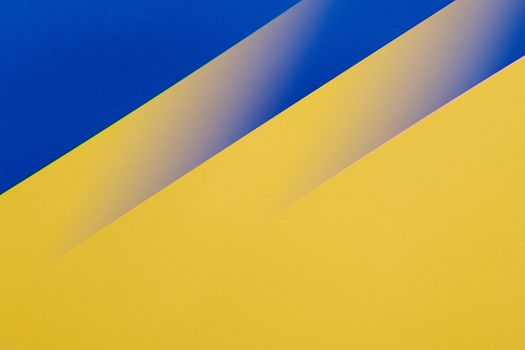 Geometric abstract design with blue and yellow diagonal stripes.