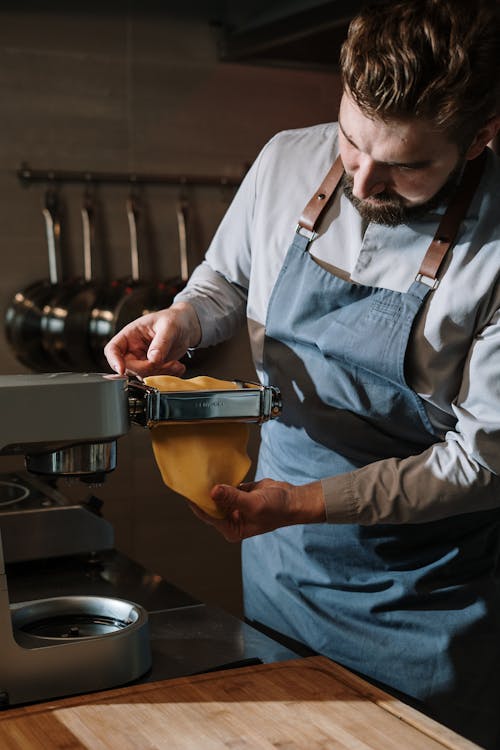 Man in White Dress Shirt Holding Yellow Plastic Container