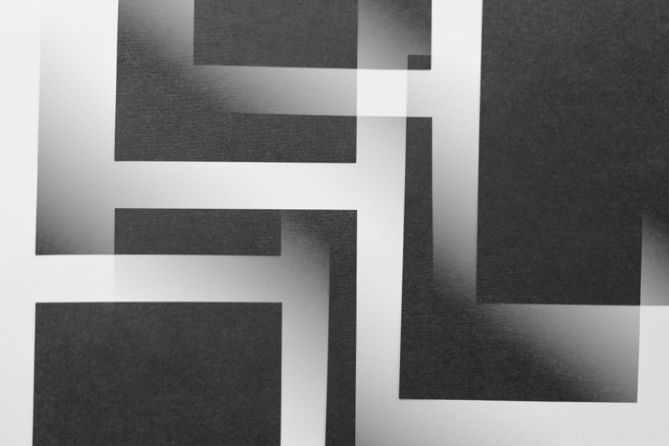 Abstract black and white geometric design with overlapping rectangles creating a modern artistic pattern.