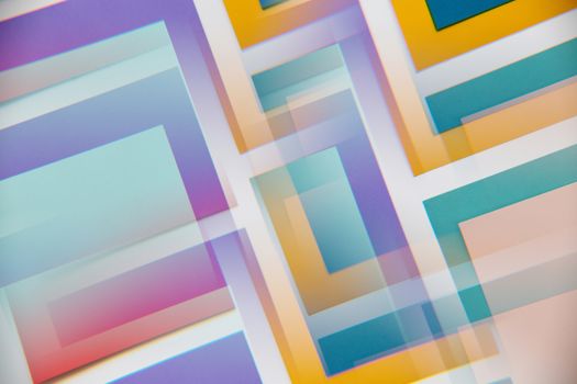 A dynamic blend of overlapping pastel geometric shapes creating a vibrant abstract design.