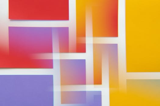A dynamic composition of colorful geometric blocks with gradient overlays creating a vibrant abstract design.