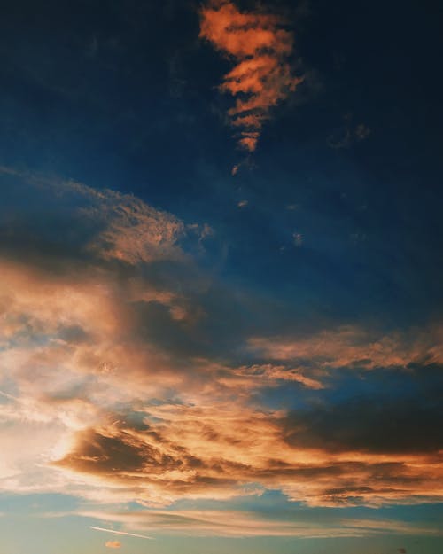 Picturesque cloudy sky during bright sundown