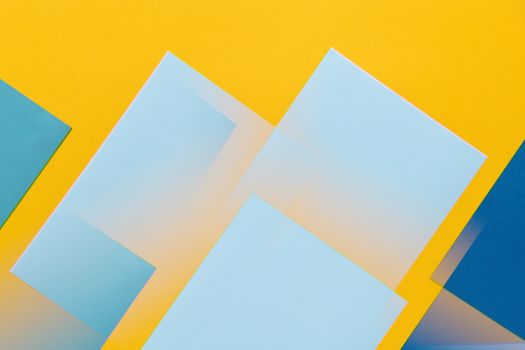 Vibrant abstract design with geometric shapes in blue and yellow hues.