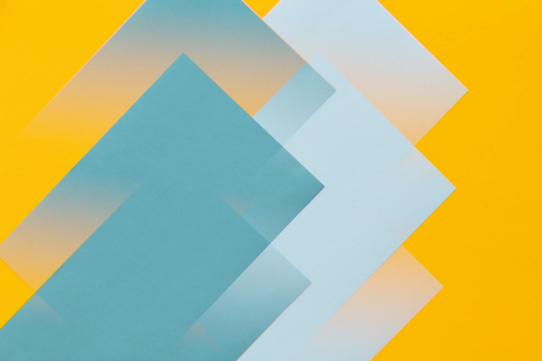 An abstract composition featuring multiple translucent geometric shapes on a vibrant yellow background.