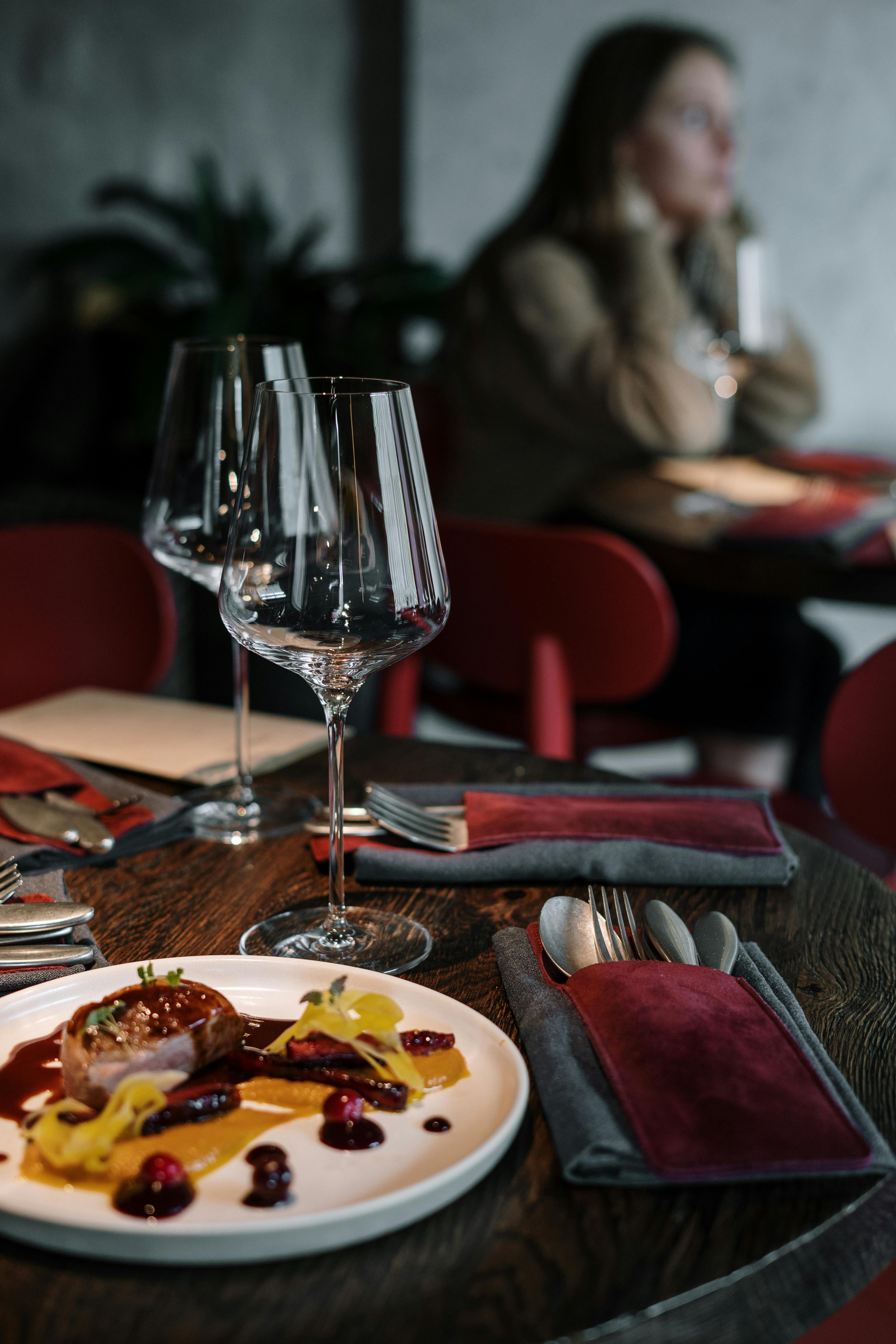 clear wine glass on brown wooden table