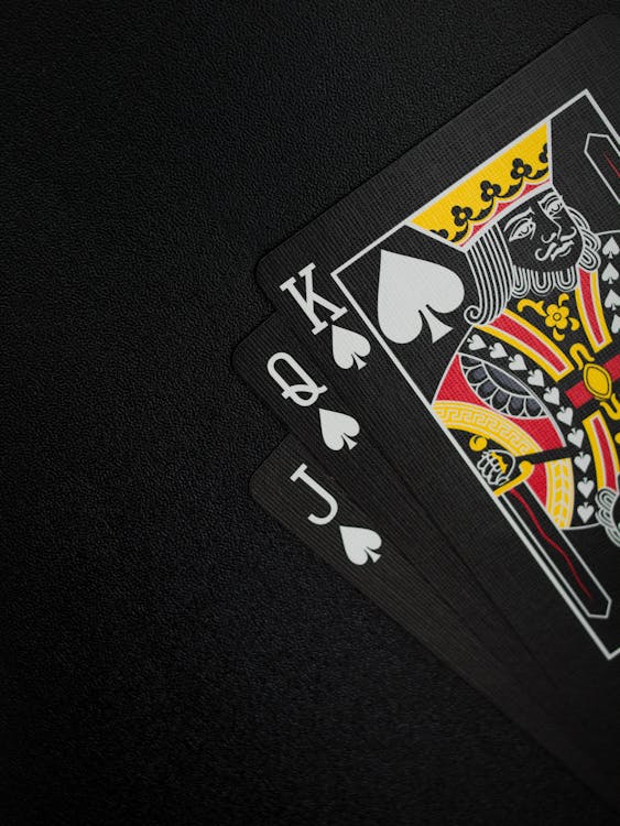 Free Black Playing Cards on Black Background Stock Photo