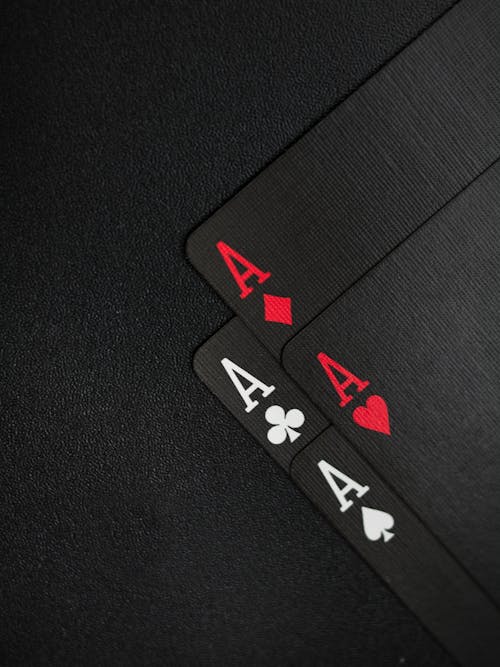 Free Black Playing Cards on Black Background Stock Photo