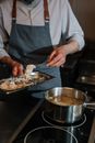 Person Holding Knife Slicing Meat