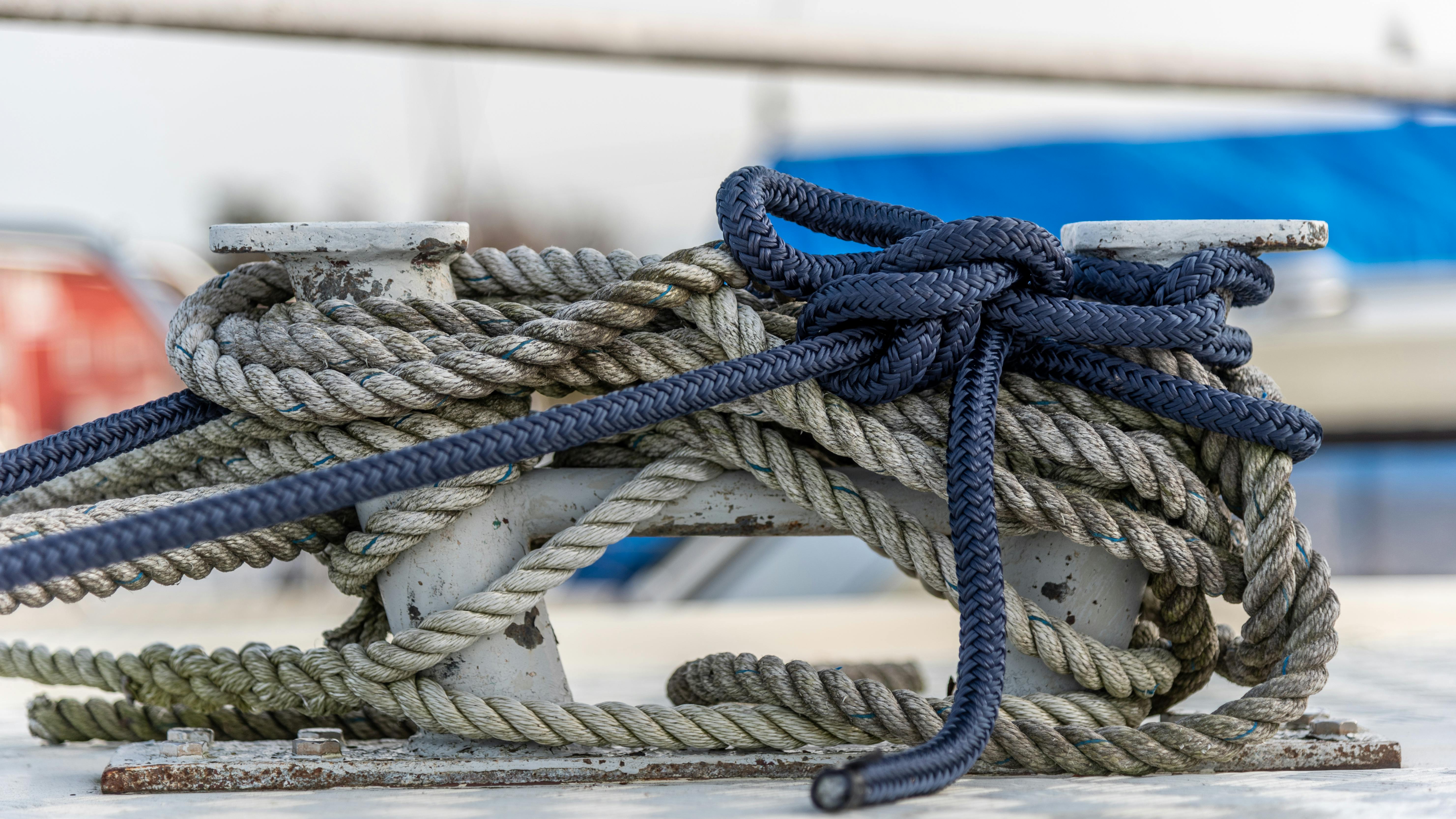Mooring ropes tied around stake on sailing ship · Free Stock Photo