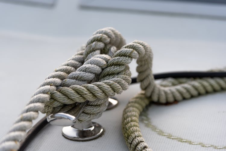 Tied Mooring Ropes On White Ship