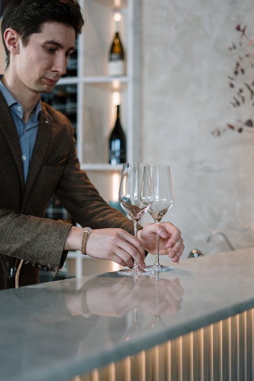 Man in Brown Suit Jacket Holding Wine Glass