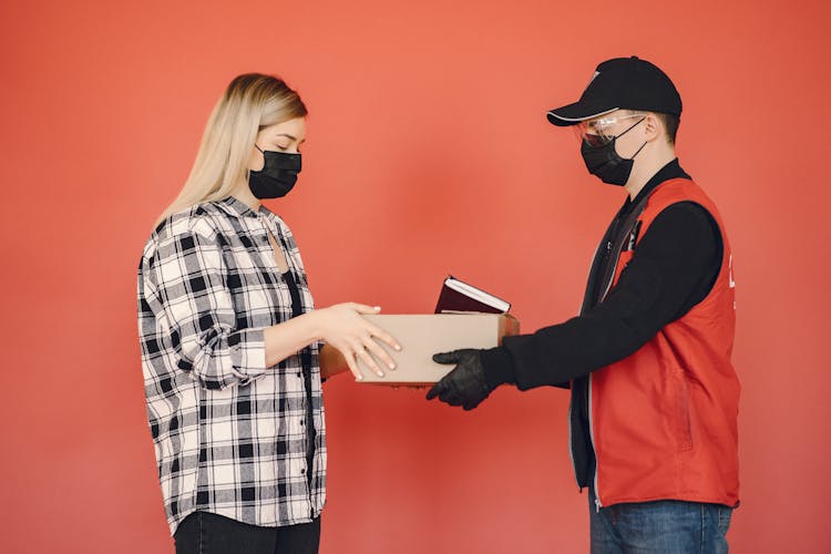 Young Female Customer Receiving Order During COVID19 Pandemic