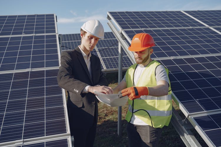 Electricians Inspecting The Solar Panels