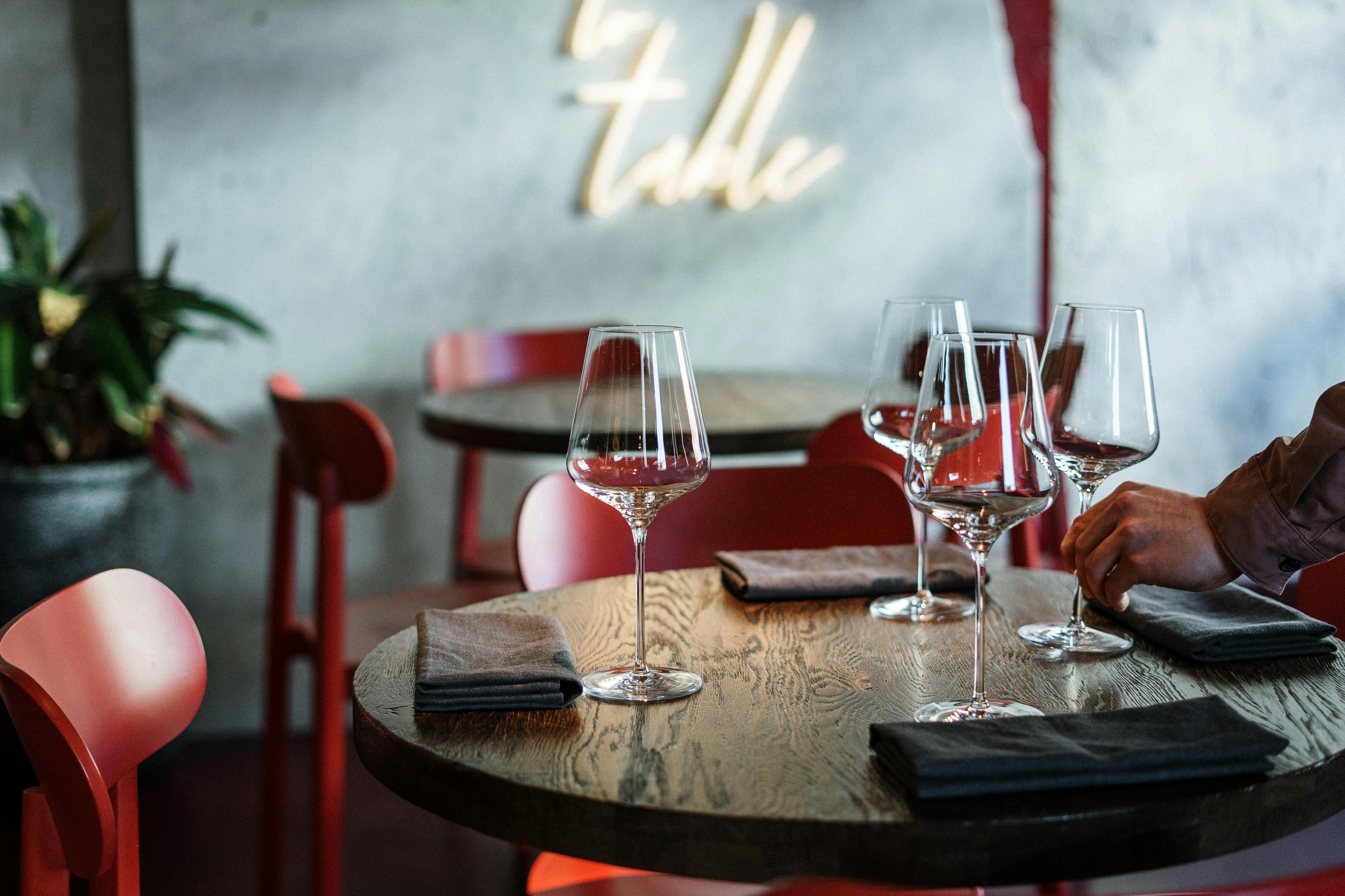 clear wine glasses on brown wooden table