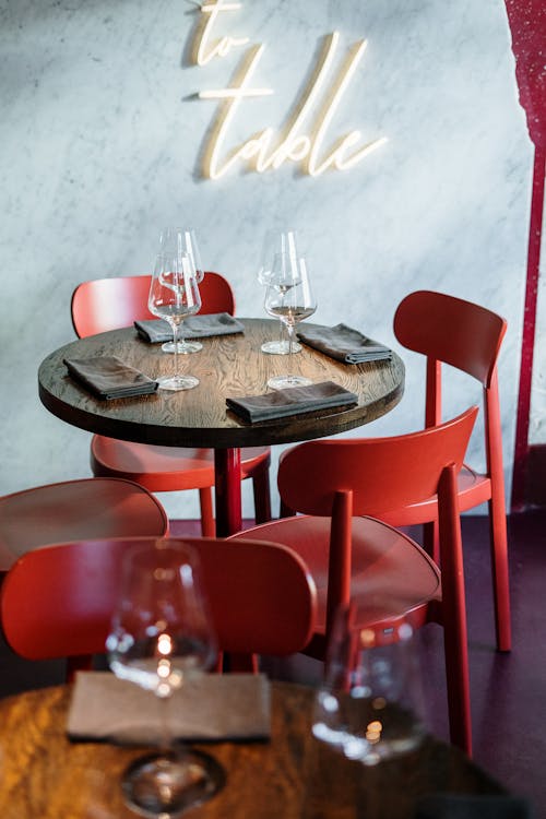 Brown Wooden Table With Red Chairs