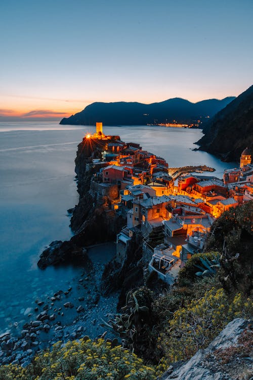 Free Breathtaking seascape with amazing coastal village on cliff Stock Photo