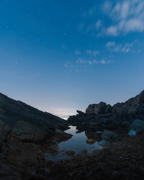 Rocky coast with shallow water in evening