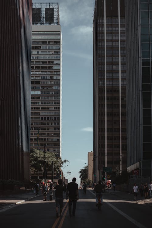 Roadway among modern skyscrapers in sunlight