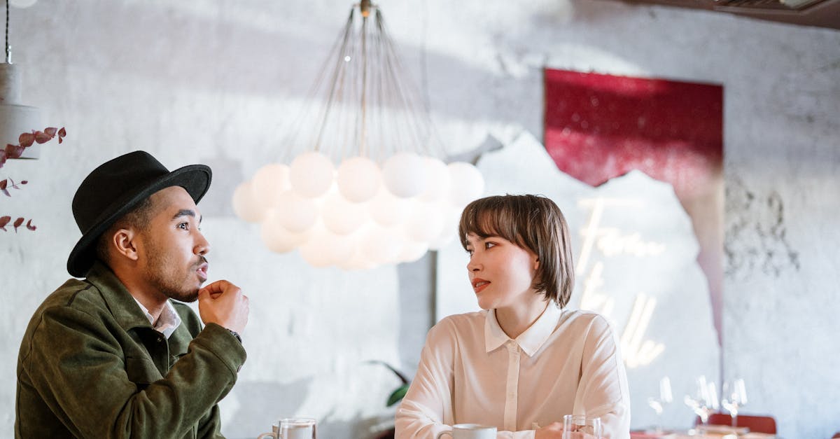 young adults having deep conversation in coffee shop, natural lighting