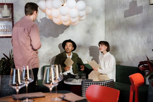 Man in White Dress Shirt Standing Beside Woman in Pink Long Sleeve Shirt