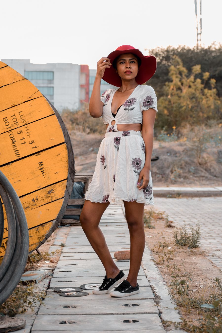 Woman in a polished summer outfit in warm sunlight