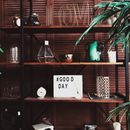 Shelves with decor and good day wish board